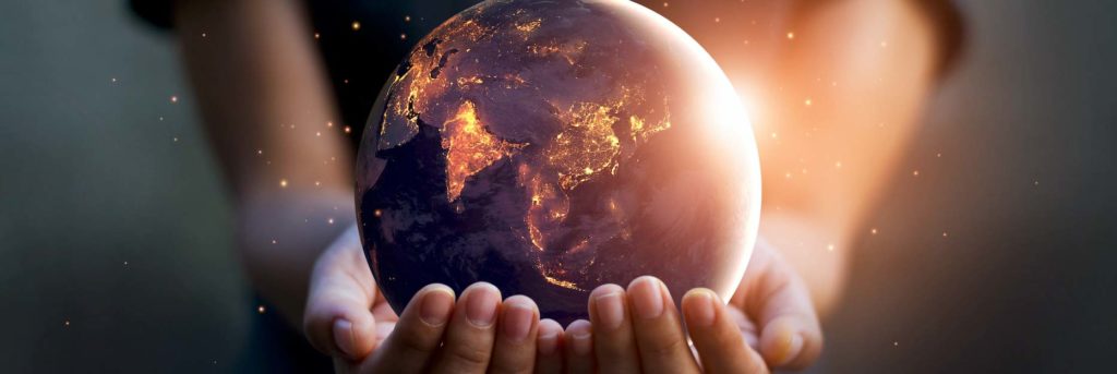 Image of a globe in someone's hands