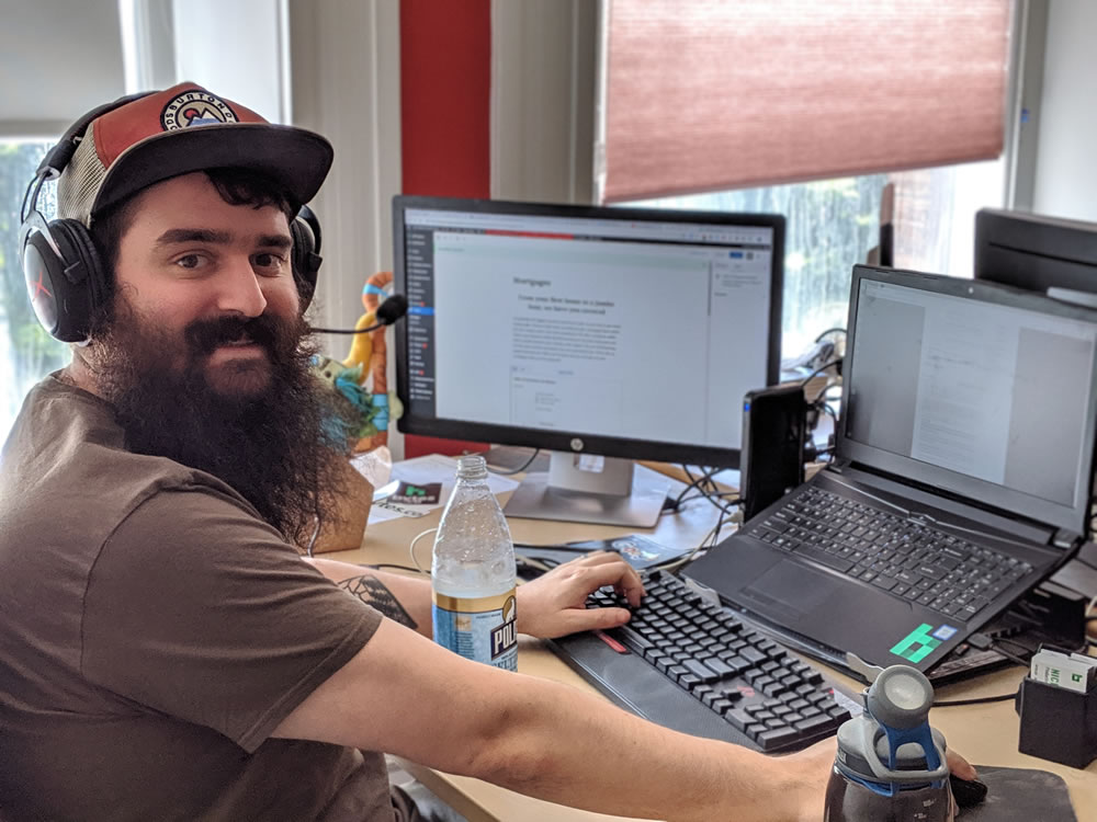 Nick Romano working at desk