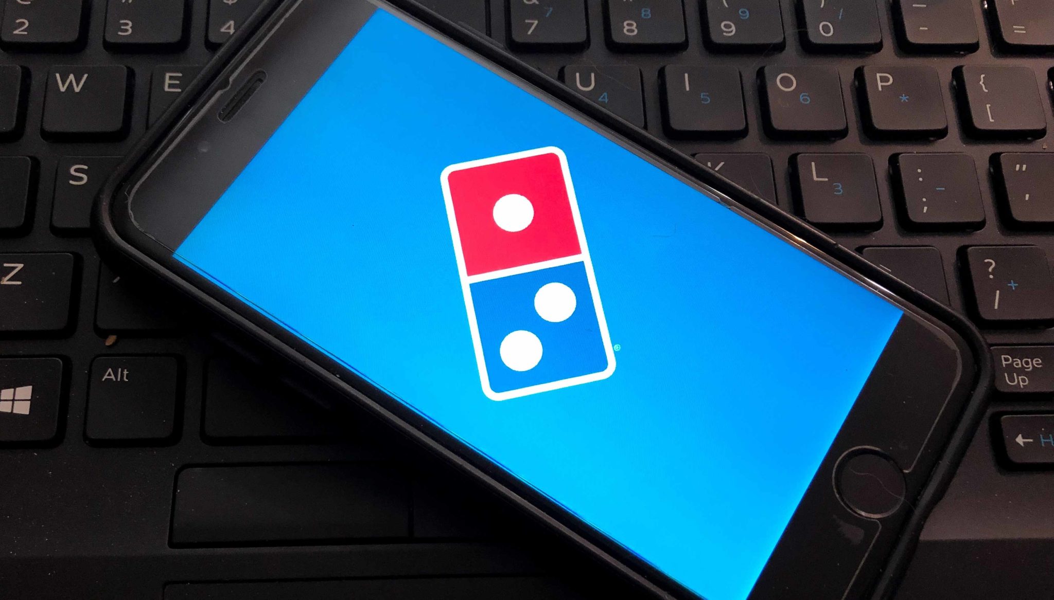 Dominos logo on the screen of a smartphone