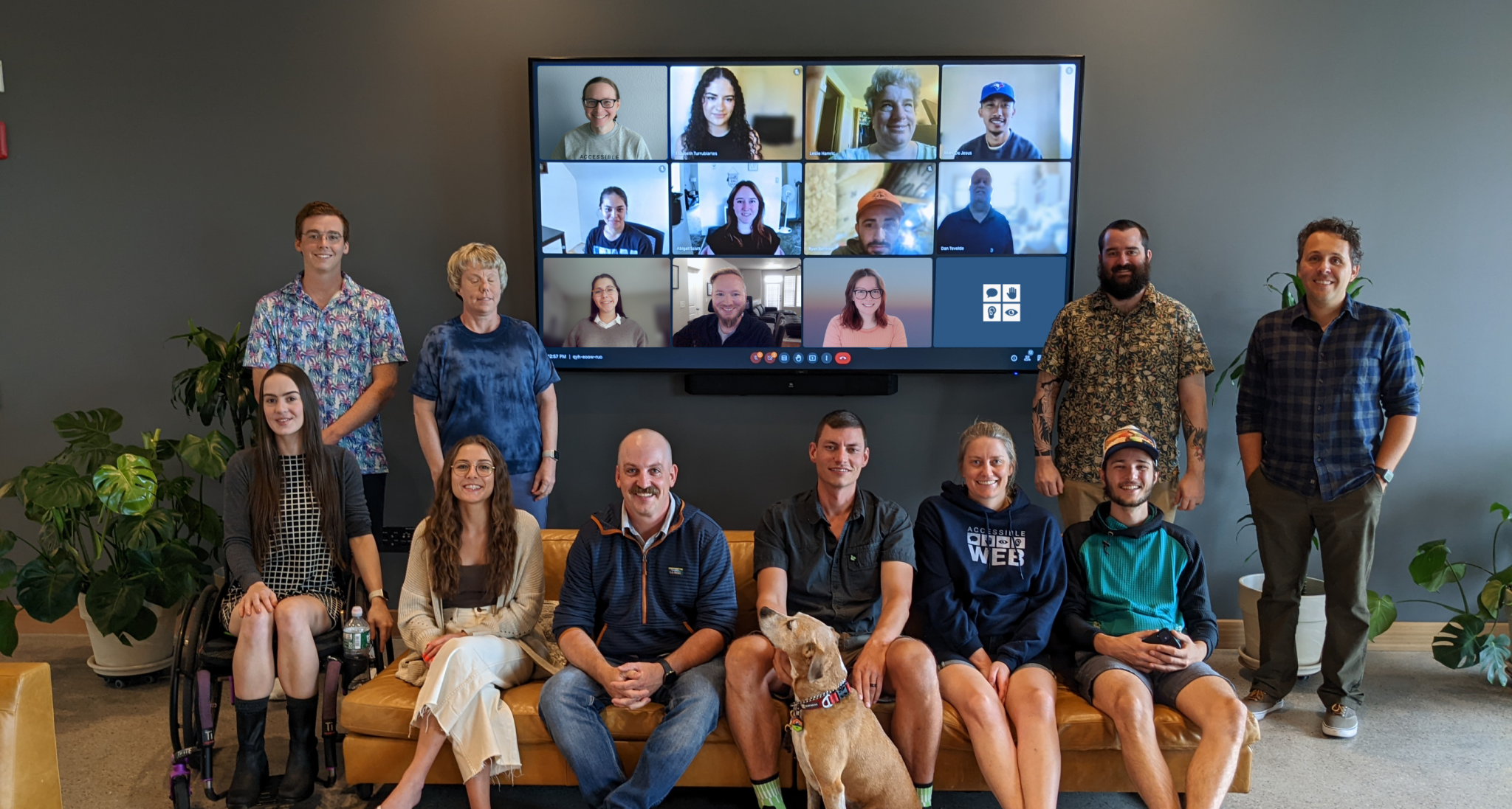 Team photo. first row seated: Gianna, Alaina, Peter Jewett, Pete Bruhn with his dog red, Lauren and Bailey. Back row standing: Ben, Heather, Nick and Scott. On the Google Meet top row: Kelsie, Liz, Leslie Marc. Google Meet second row: Nicole, Abby, Ryan and Dan. Google Meet third row: Sophia, Kenneth, Meghan.